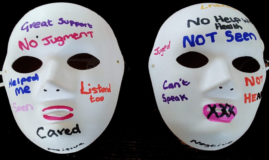 Two face masks. One with words about good care, the other with words about bad care